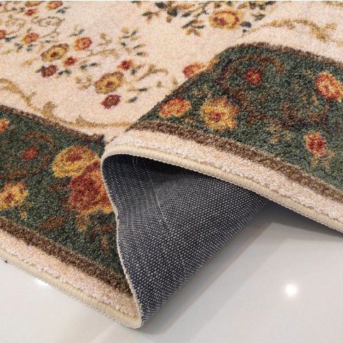 Zielony prostokątny dywan w kwiaty do sypialni Epris