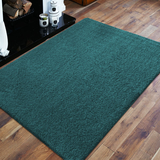 Zielony antypoślizgowy dywan do salonu Mavox