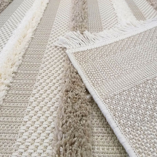 Beżowy nowoczesny dywan w stylu boho z frędzlami Niros