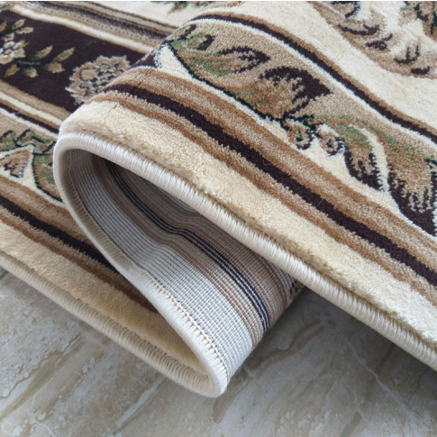 Brązowy dywan we wzory do salonu Turris