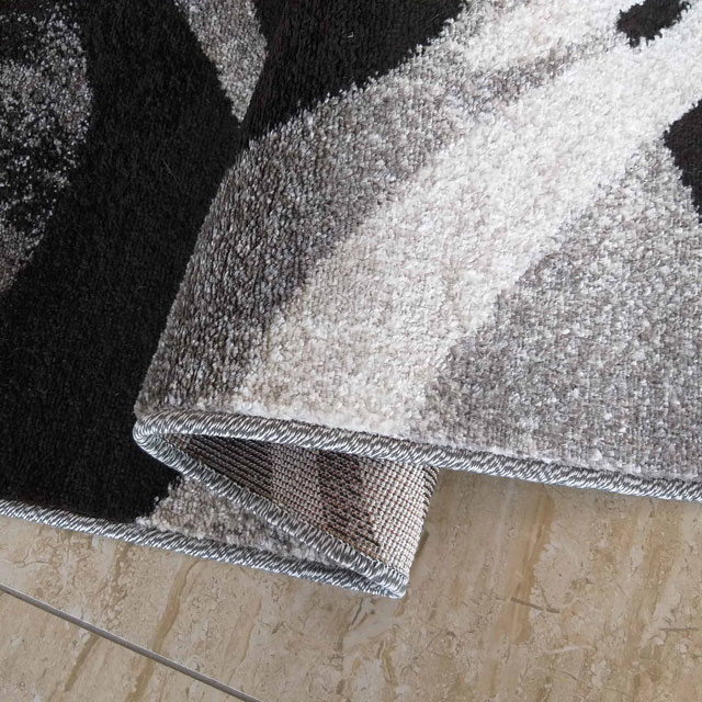 Szary prostokątny dywan z falistymi wzorami Dravi
