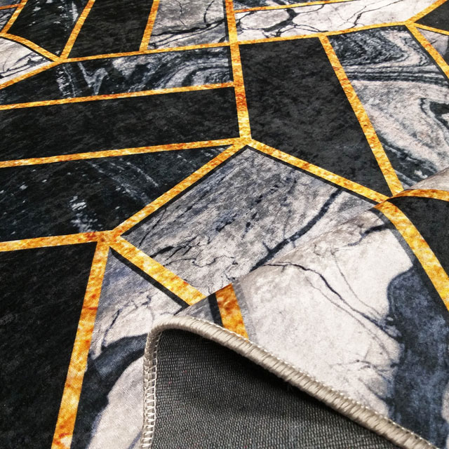 Czarno-szary geometryczny dywan glamour z dodatkiem złotego Akris