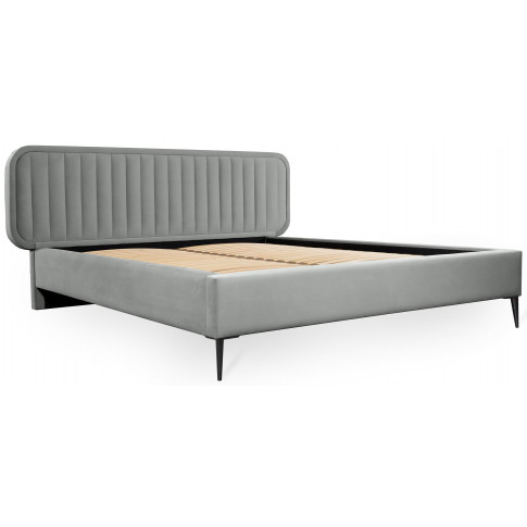 nowoczesne łóżko tapicerowane z owalnym zagłówkiem