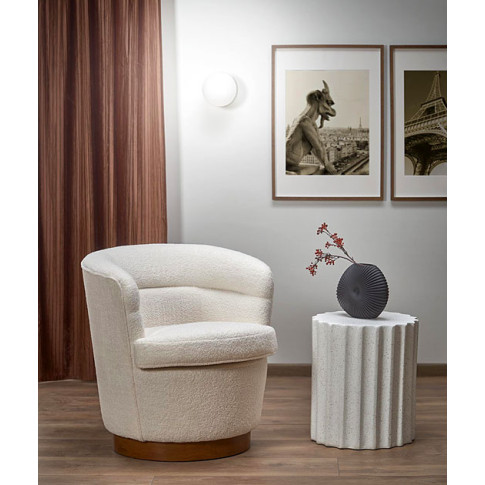 Fotel kremowy tapicerowany tkaniną boucle Dixo