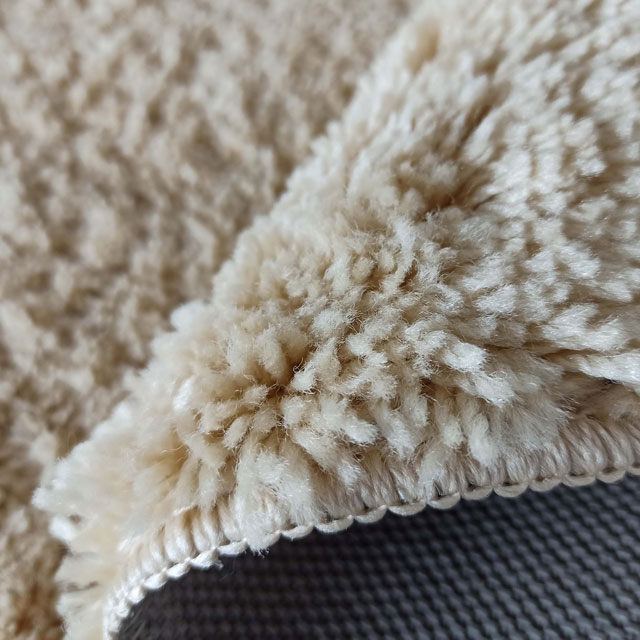 Beżowy okrągły dywan shaggy Moxi
