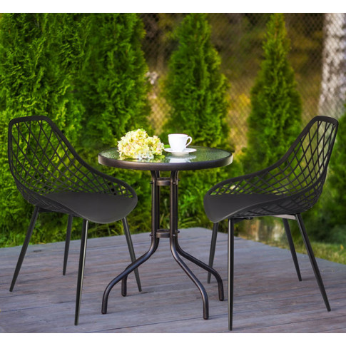 taras ogrodowy z wykorzystaniem czarnego krzesła ażurowego Kifo 5X