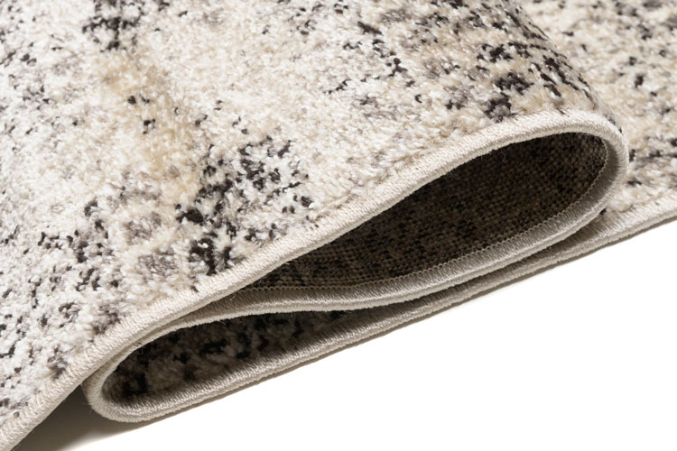 Beżowy dywan w brązowe wzorki do salonu Uwis 4X