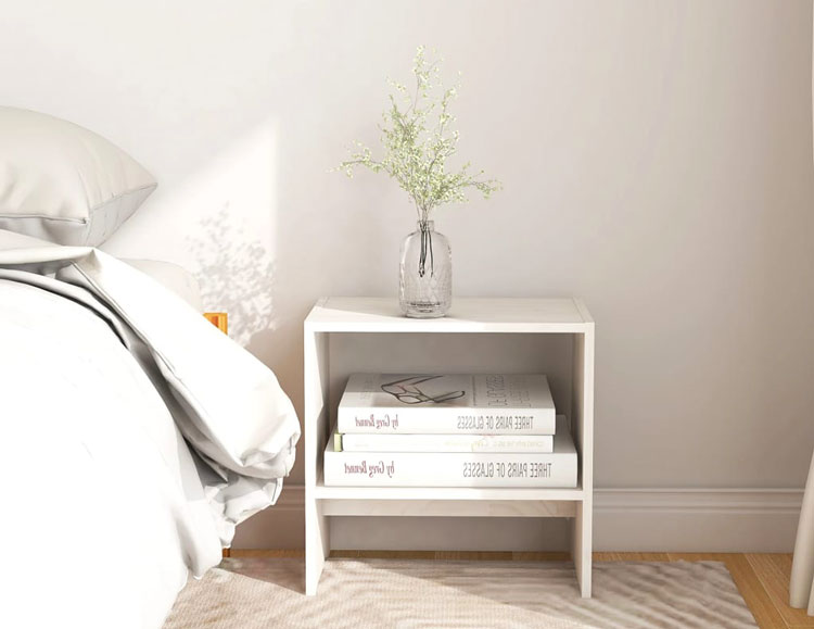 Drewniana biała szafka nocna Xano w przykładowej sypialni