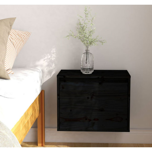 Czarna szafka drewniana nocna wisząca Pios 3X w nowoczesnej sypialni