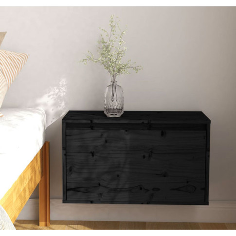 Czarna drewniana szafka nocna Pios 4X w nowoczesnej sypialni