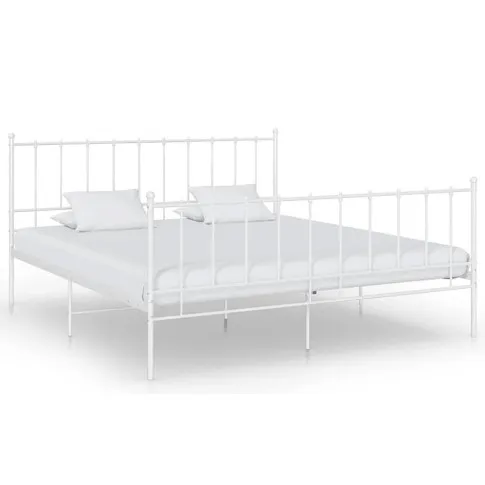 Białe metalowe łóżko 