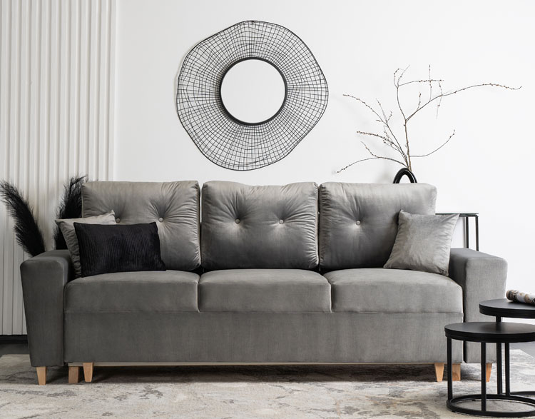 Szara welurowa sofa z funkcja spania Kanoni