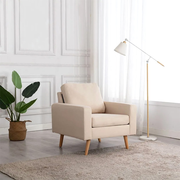 Kremowy skandynawski fotel Nosa