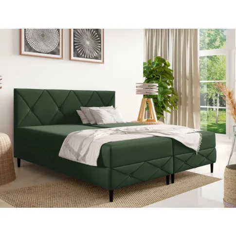 Sypialnia z zielonym łóżkiem Riessa