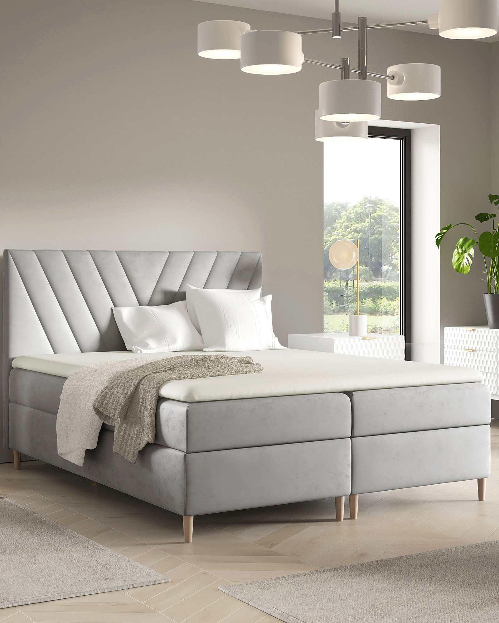 Aranżacja wnętrza z szarym łóżkiem