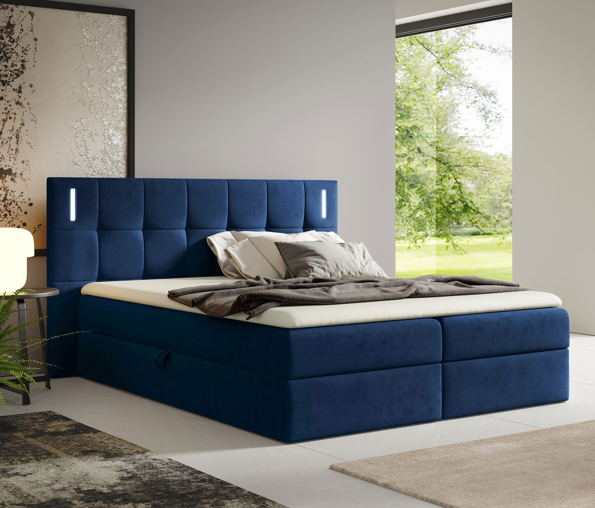 Aranżacja wnętrza z łóżkiem w kolorze granatowym