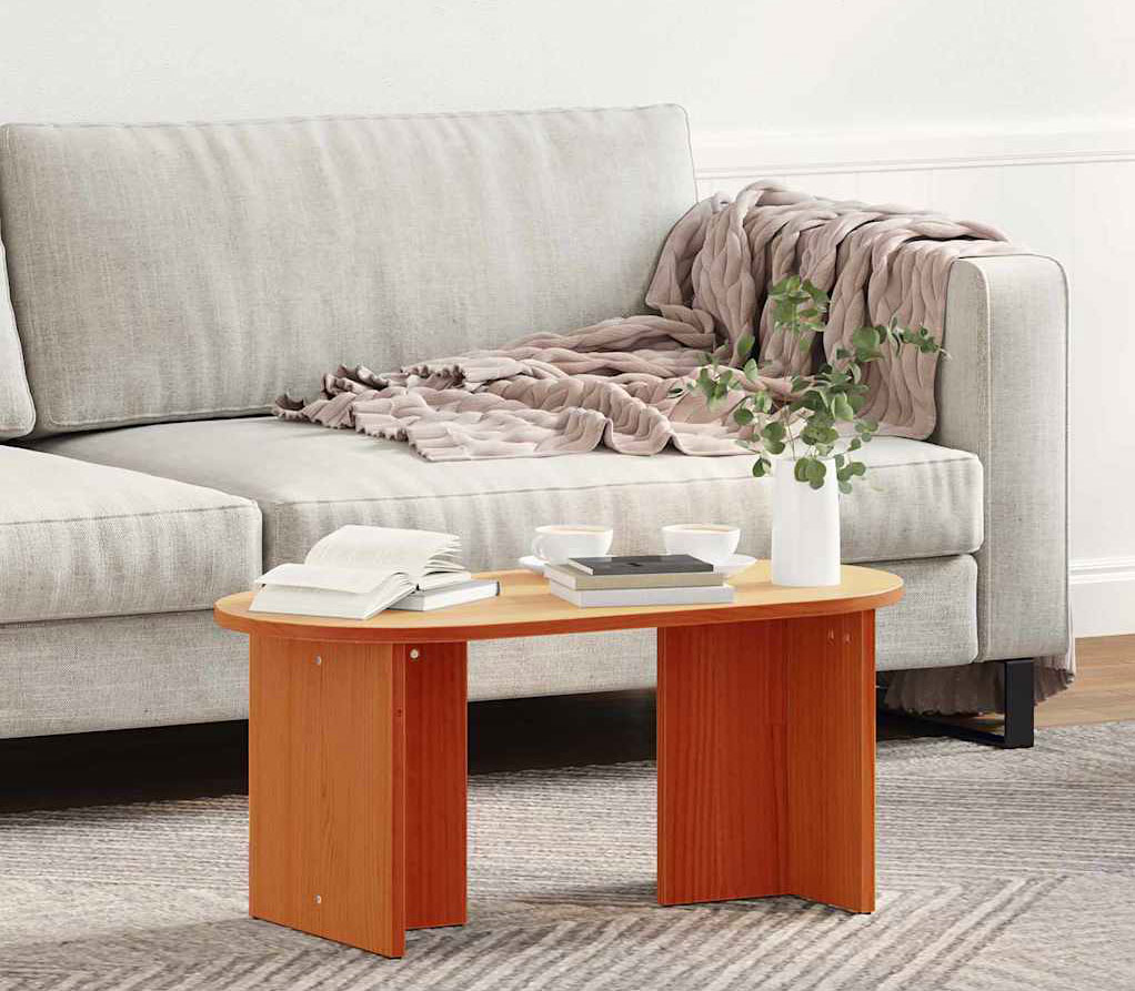 Minimalistyczny salon z wykorzystaniem owalnego stolika kawoego Zovini woskowy brąz