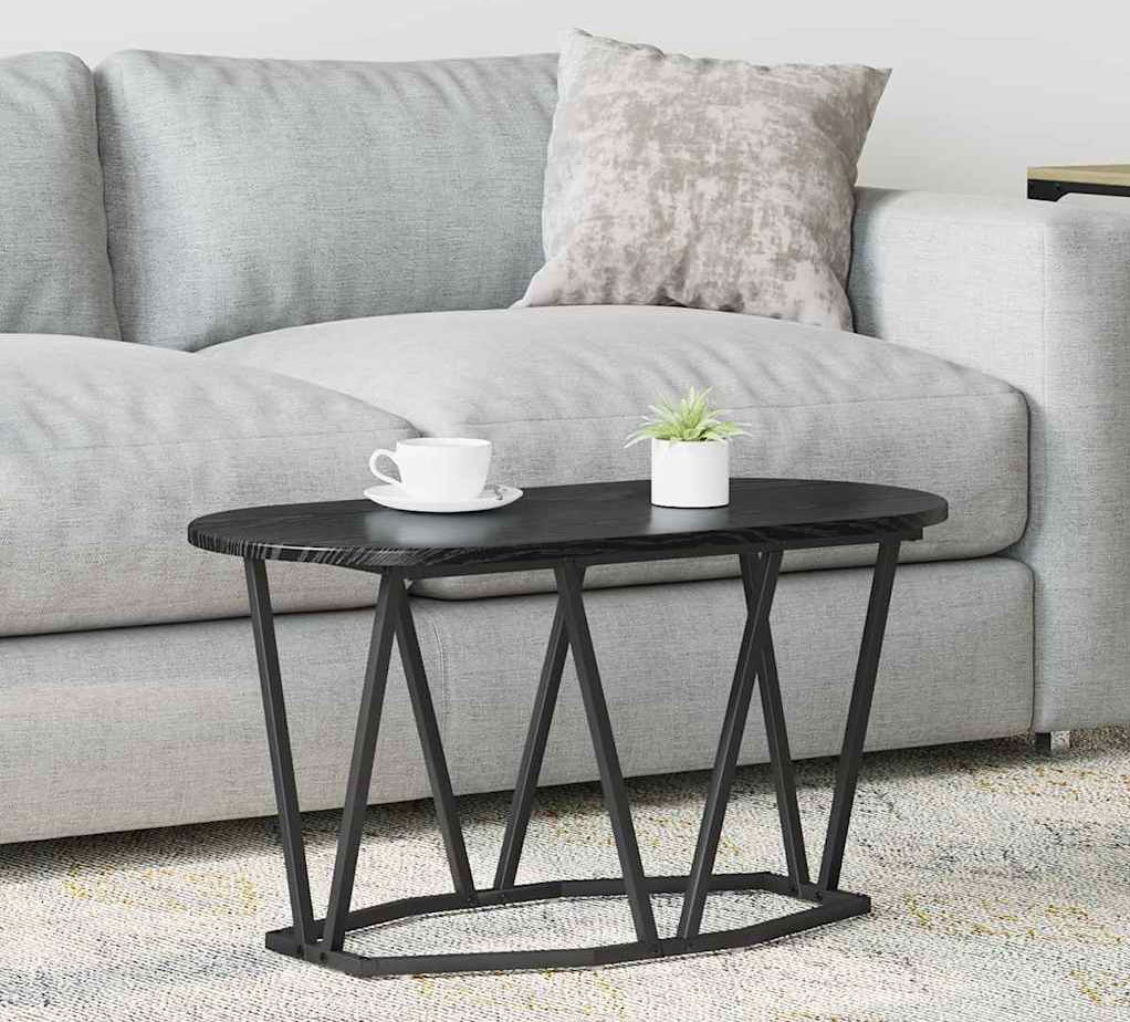 Przykładowa aranżacja z owalnym stolikiem kawowym Ebin czarny dąb