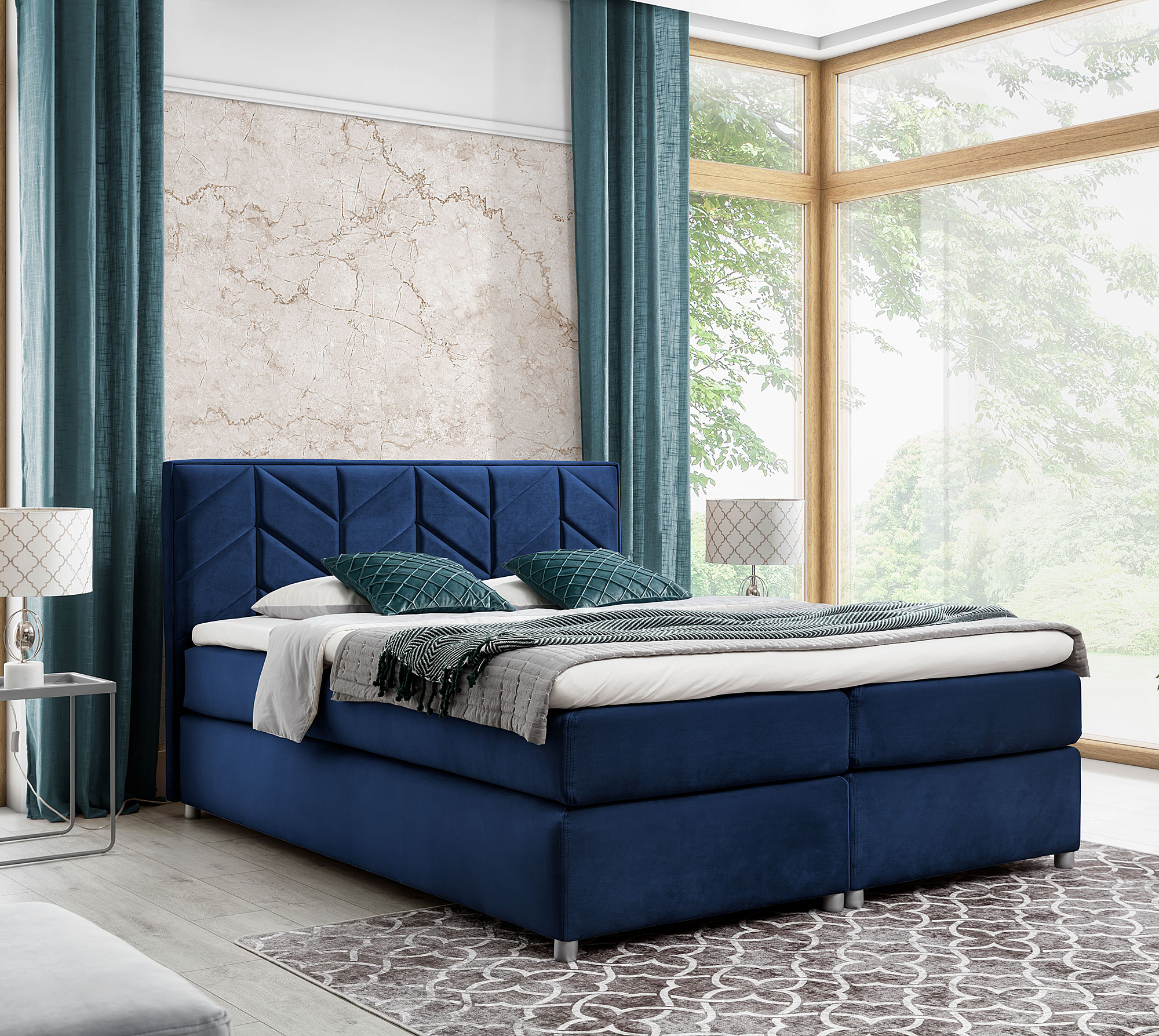 Aranżacja wnętrza z granatowym łóżkiem Ferlevio