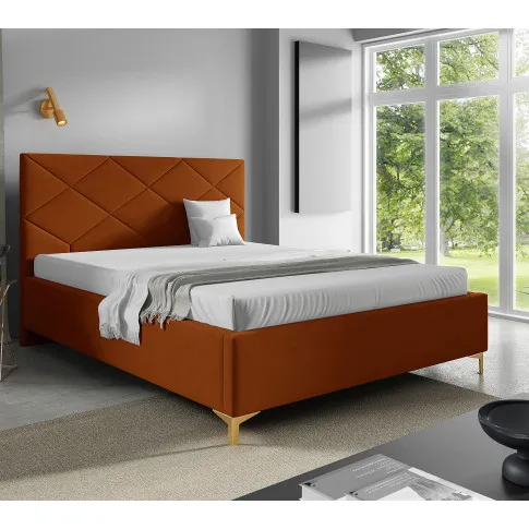 Aranżacja sypialni z pomarańczowym łóżkiem Tollviano